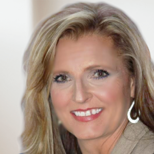 Professional portrait of a woman with blonde hair wearing silver hoop earrings and a warm smile against a soft focus background