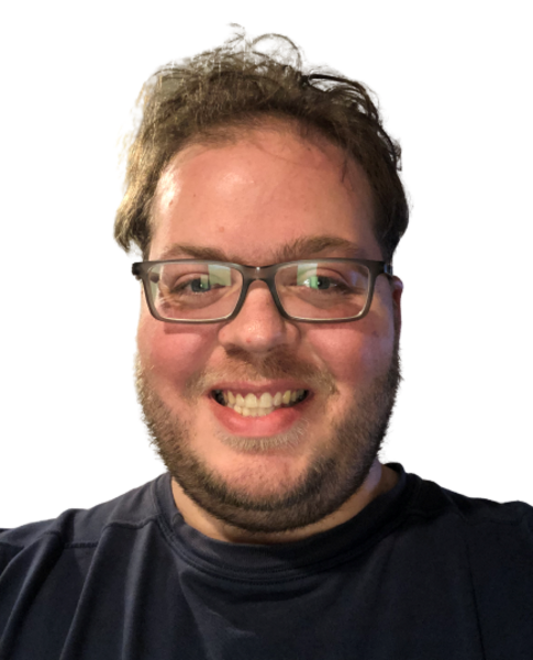 Portrait of person with glasses wearing black shirt, showing genuine smile against neutral background