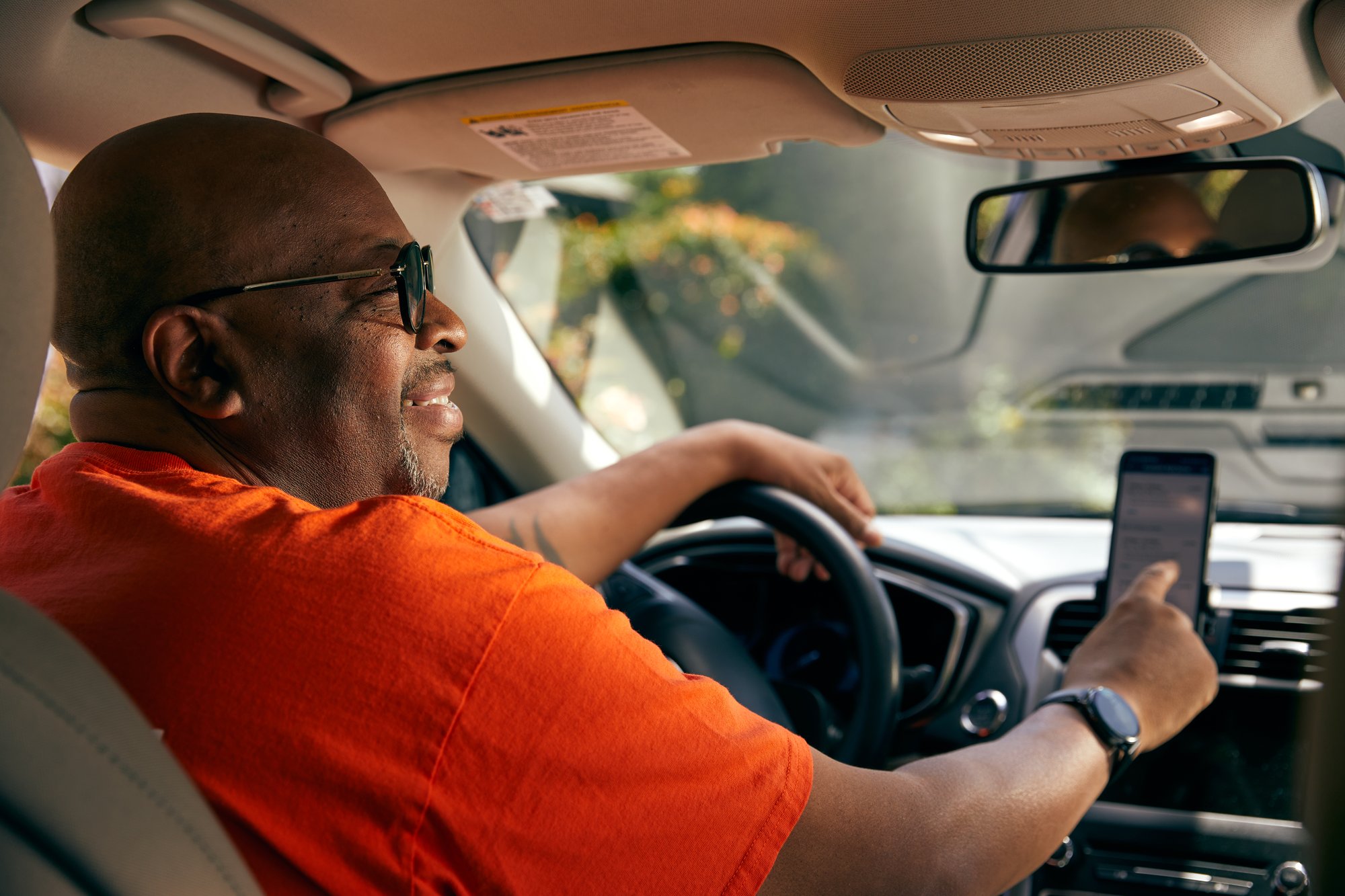 Rideshare driver making money doing part time work in his free time