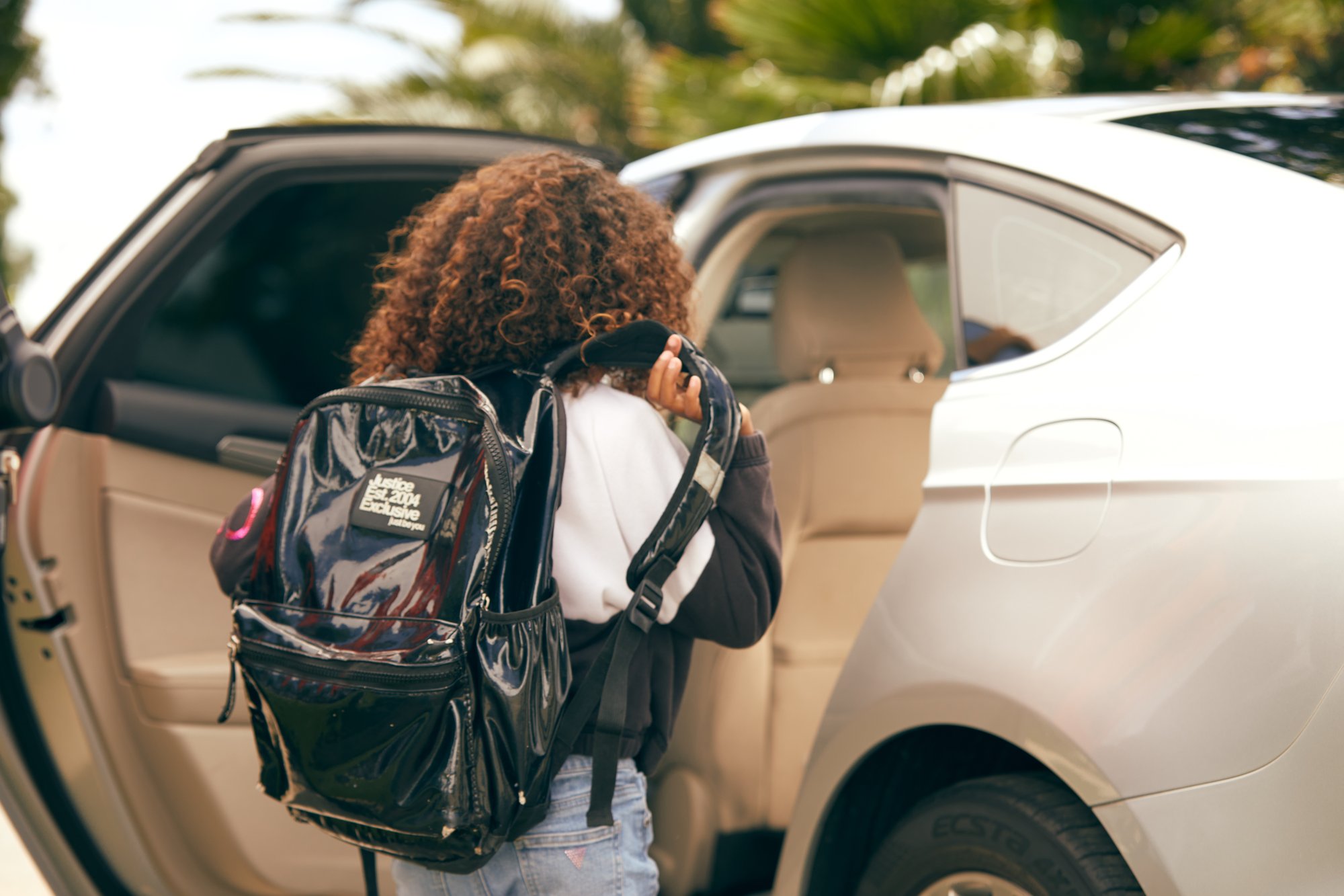 Rider gets into well maintained vehicle used for rideshare driving